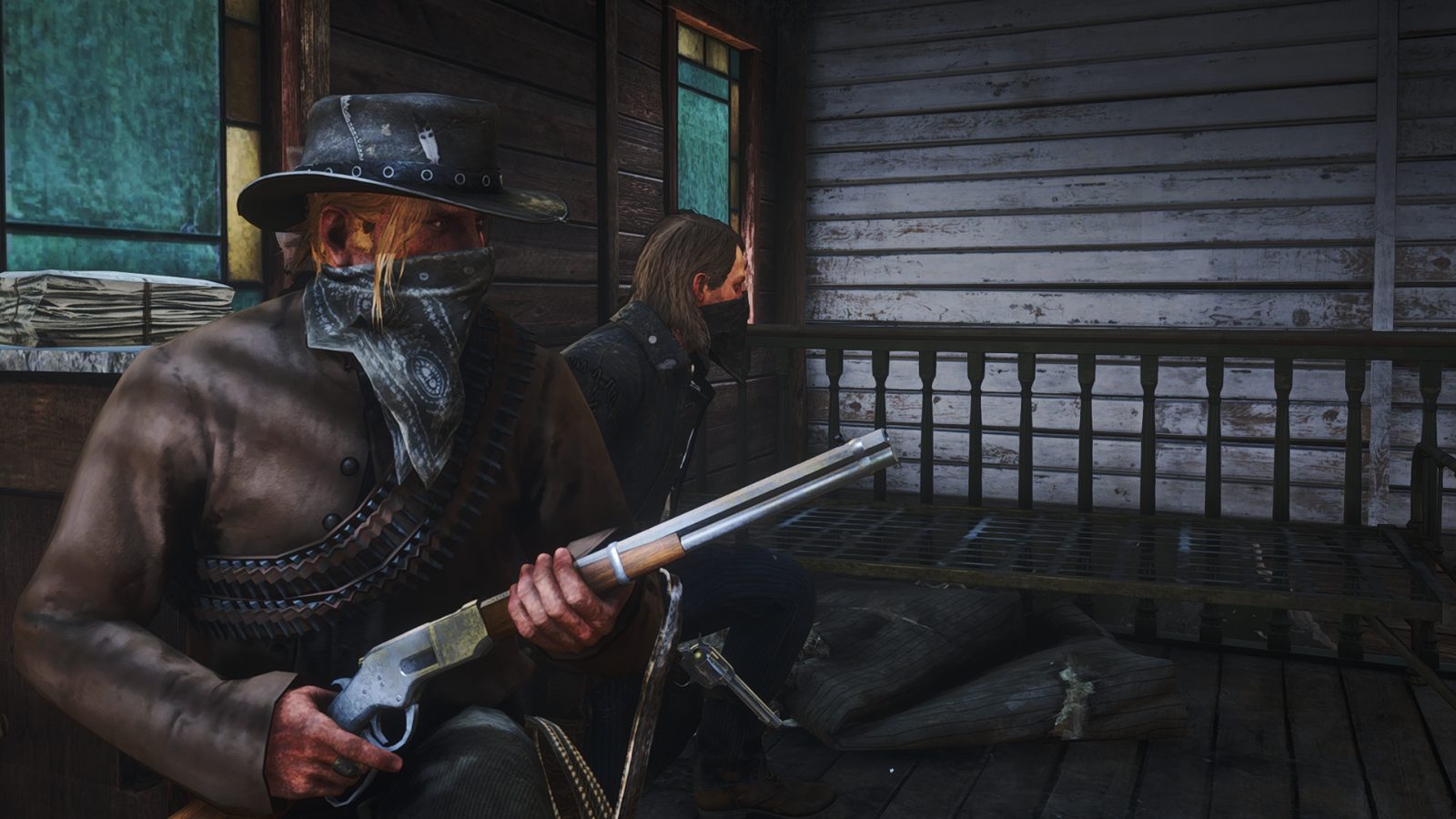 Two outlaws holed up on a porch